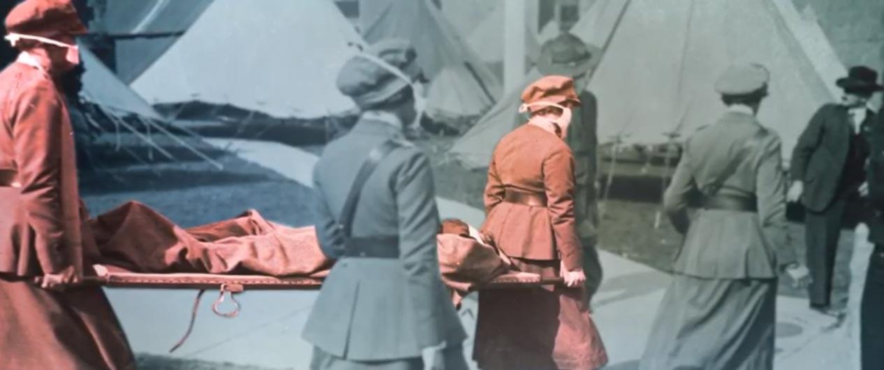 Colorized photo of masked nurses in uniform dresses carrying a stretcher with a person on it.