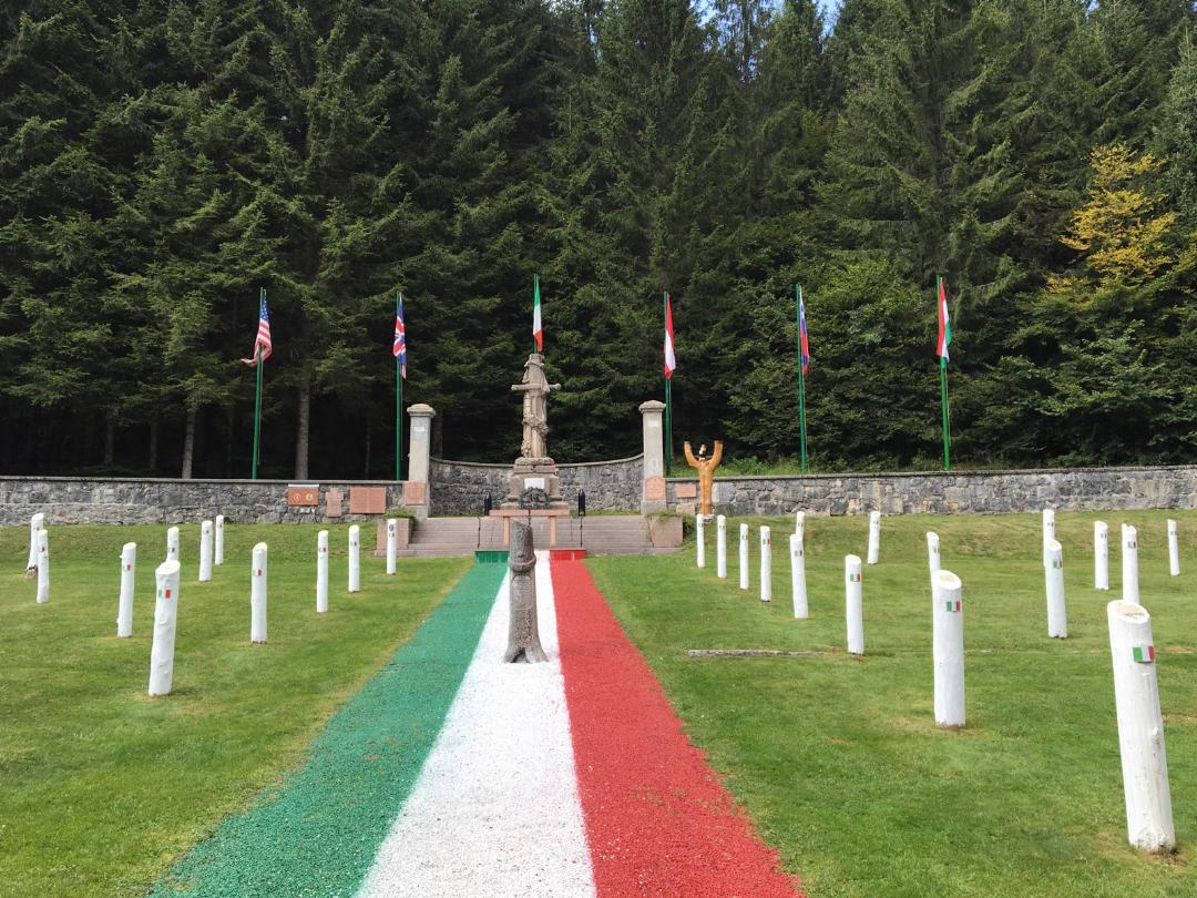 Italian graves marked with white wooden posts