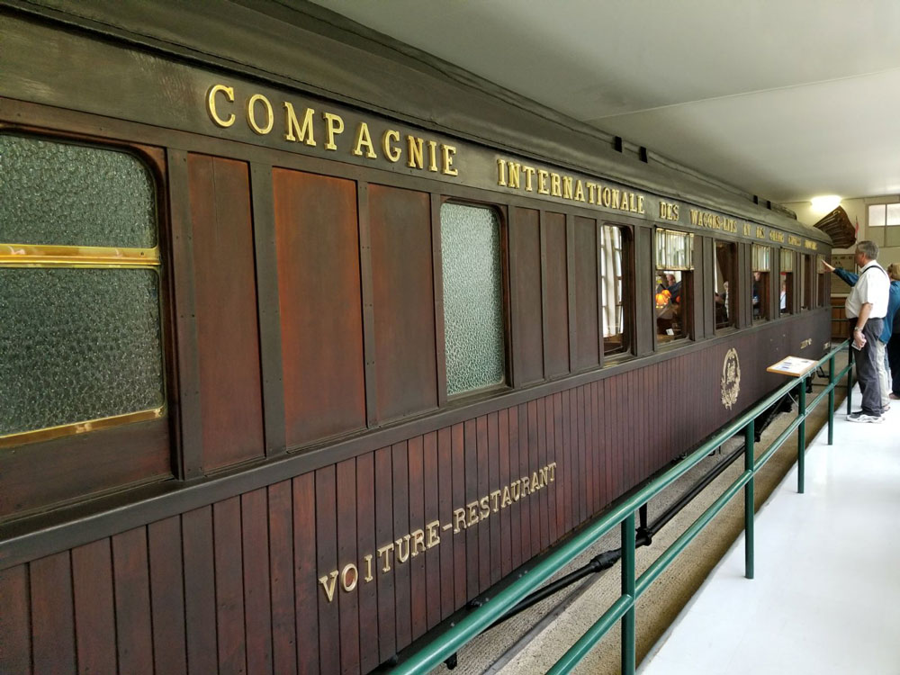 Photograph of a museum display of a train rail car.