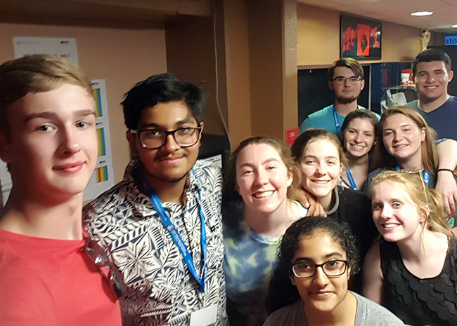 Selfie photograph of a group of male and female high school students.