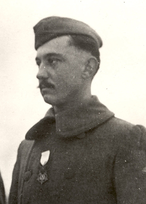 Black and white photograph of a white man with a mustache wearing military uniform.