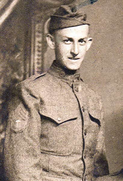 Sepia portrait photograph of a young white man in military uniform.