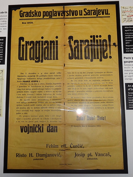 Museum display of a yellowed newspaper broadside