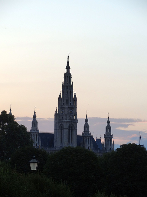 Spires silhouetted against a blue and orange sky