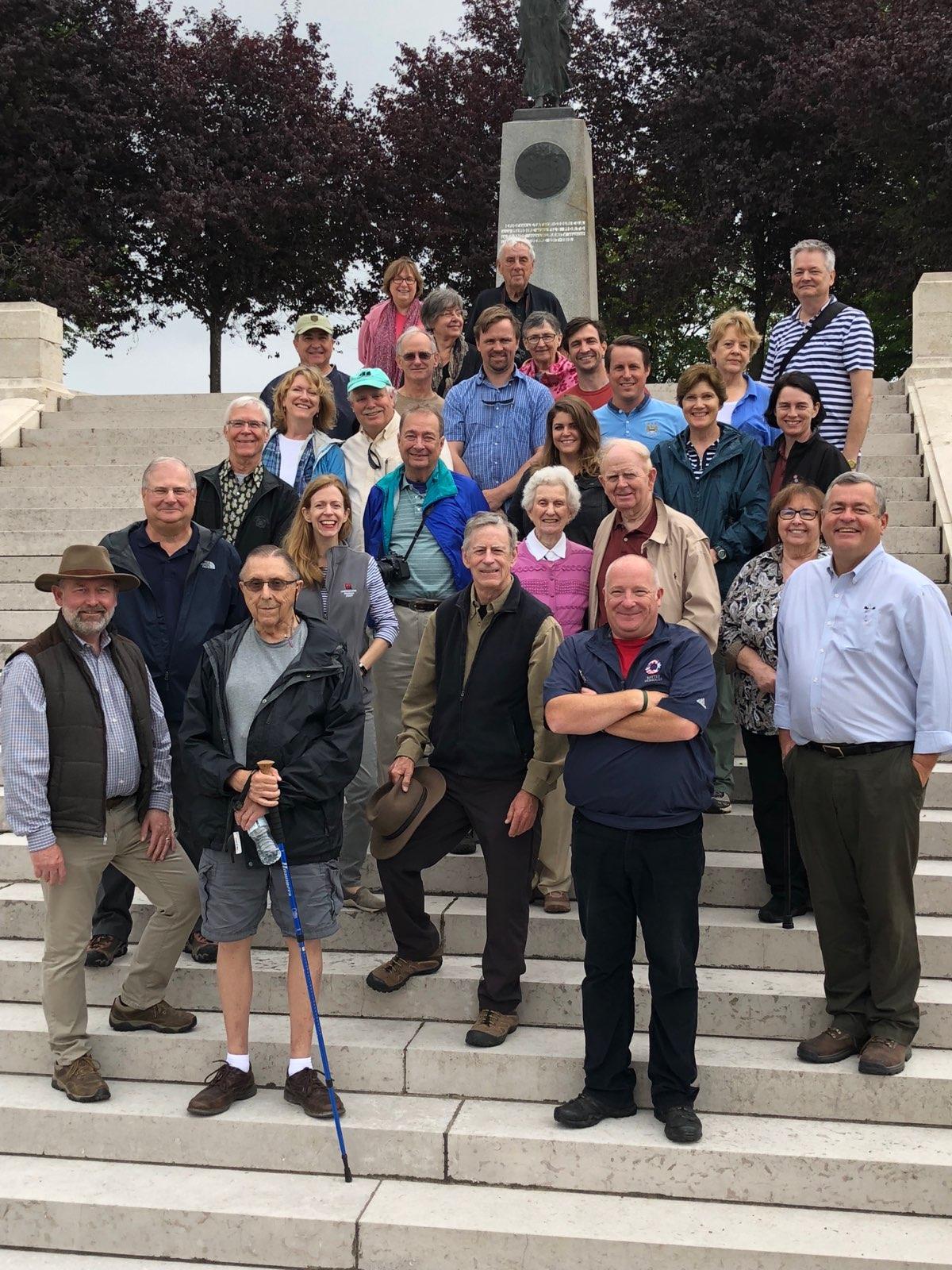 The tour group posing on the steps leading up to the Missouri monument.
