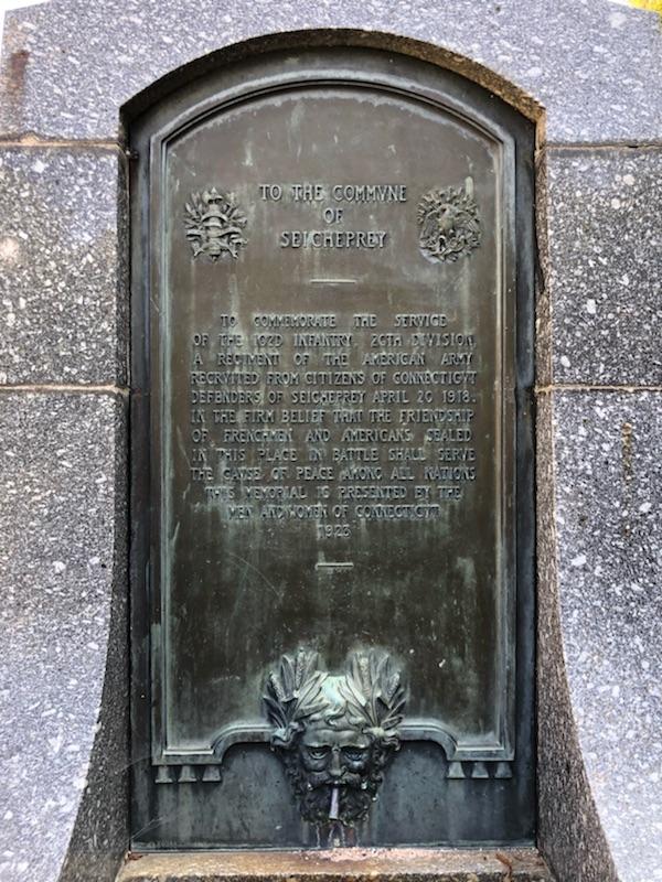 Stone fountain with a bronze plaque