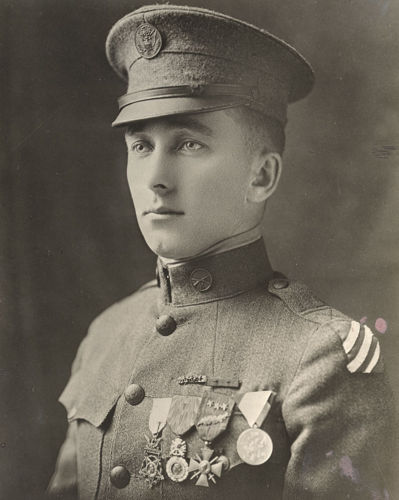 Black and white portrait of a young white man in military uniform