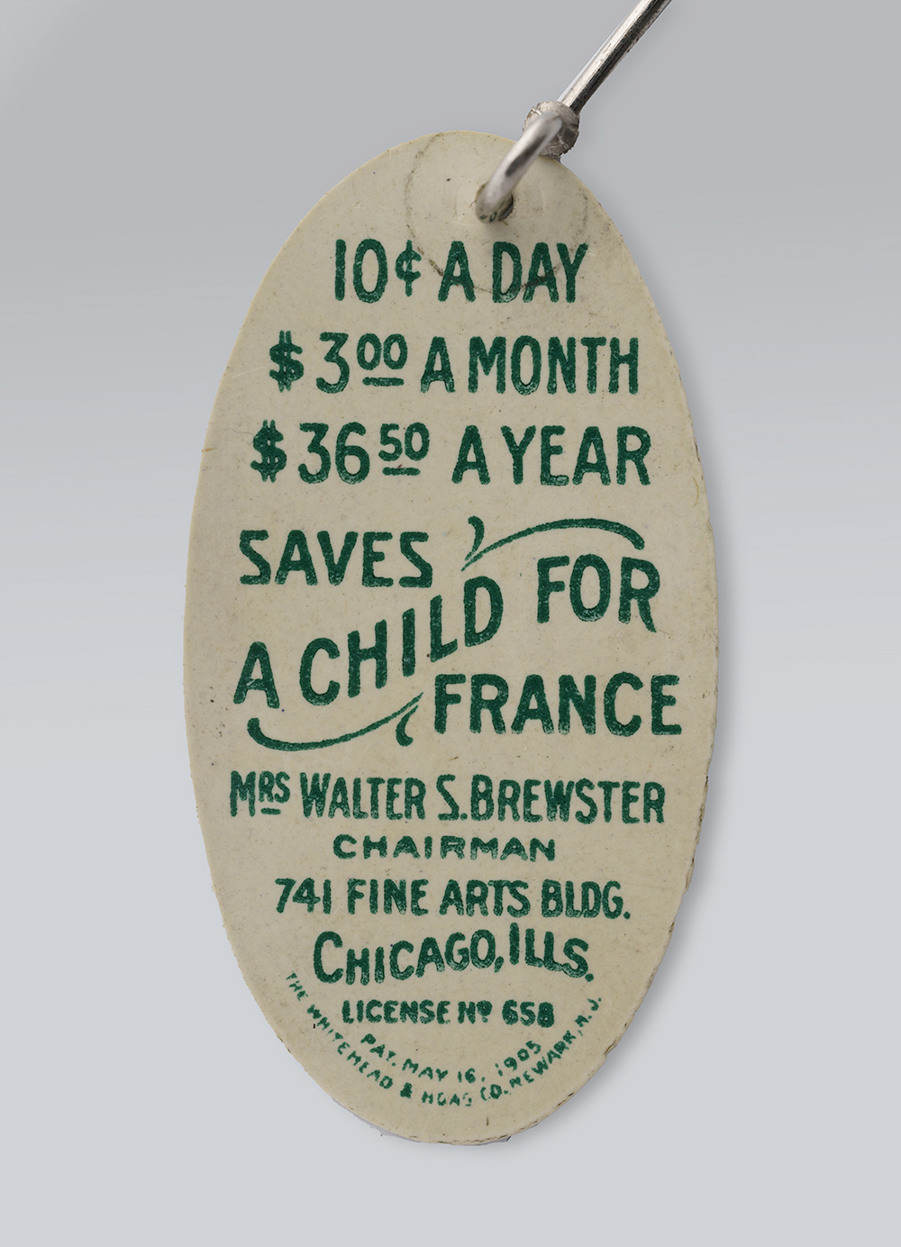 Back of an oval pin. Text: '10¢ a day / $3 a month / $36.50 a year / Saves a child for France'