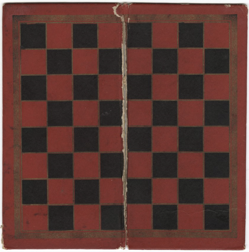 Modern photograph of a worn-down black and red checkerboard that folds in the middle.