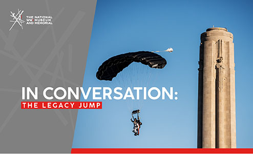 Image: Modern photo of the top half of the Liberty Memorial Tower against a stunning blue sky. Two skydivers in tandem are parachuting down right next to it. Text: 'In Conversation: / The Legacy Jump'