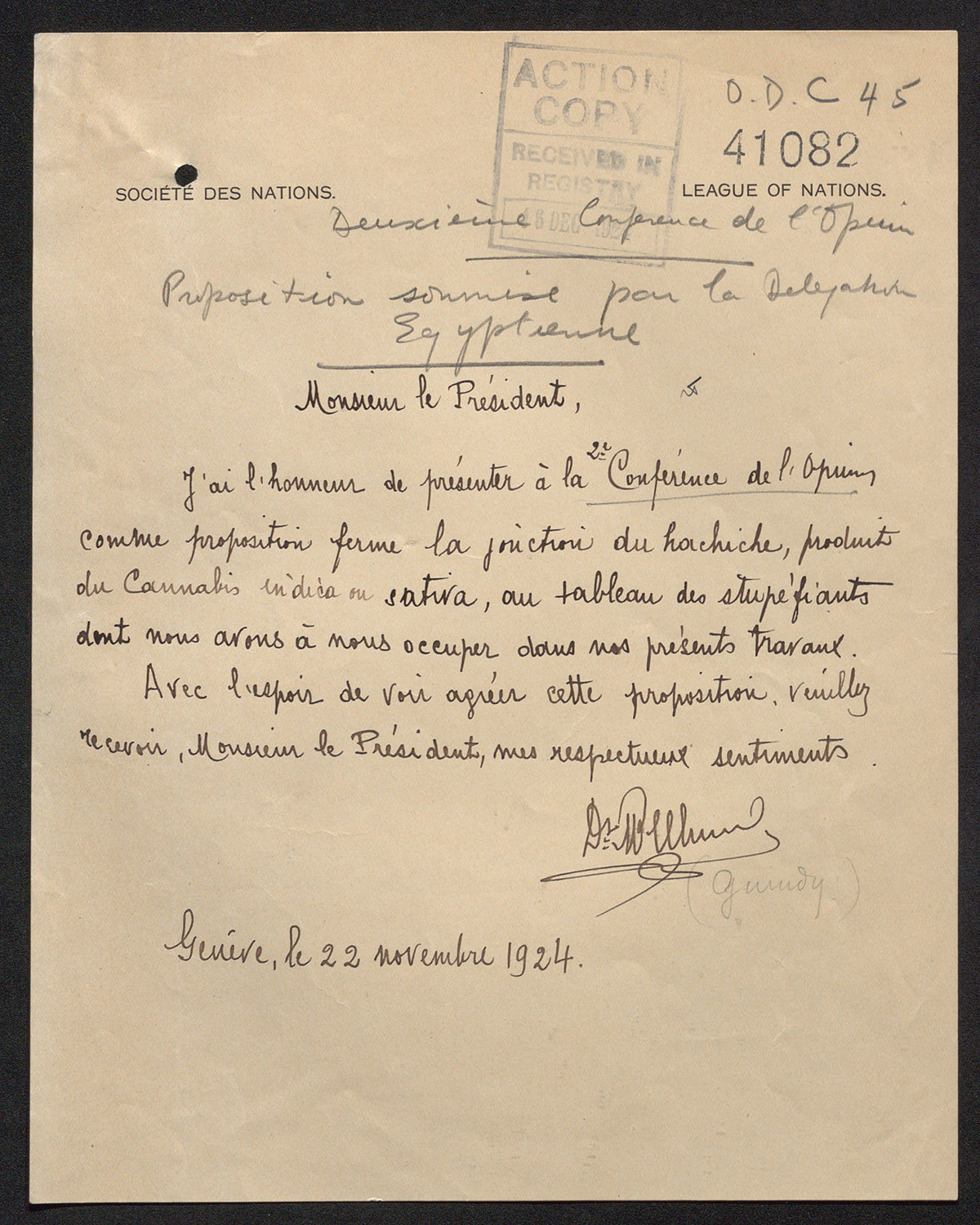 Scan of a yellowing piece of official stationery with cursive handwriting in French on it