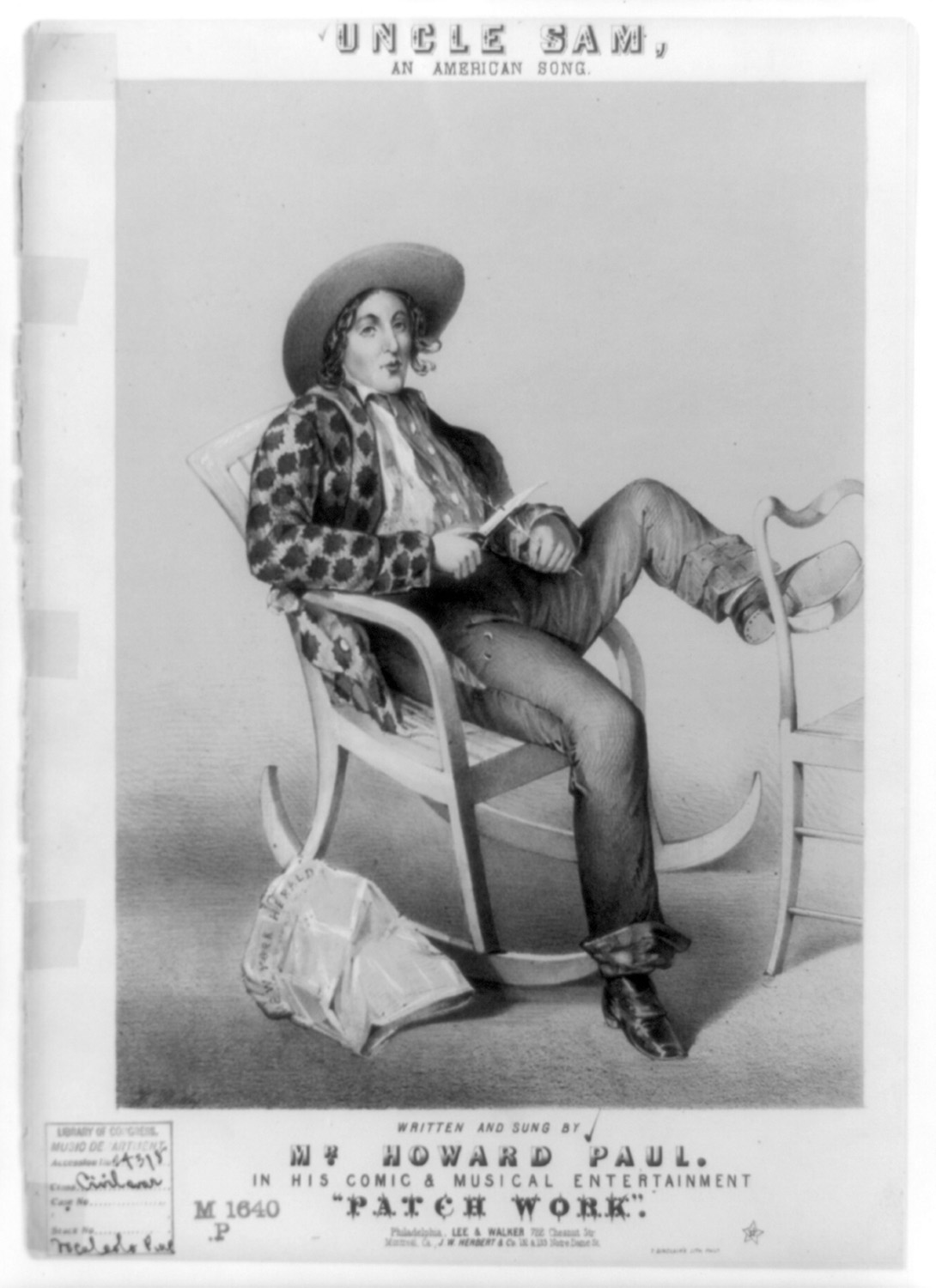 Illustration of Uncle Sam as a young man in a wide-brimmed hat and patchwork jacket. He sits whittling with his jackknife in a rocking chair. On the floor near his chair lies a crumpled copy of the "New York Herald."