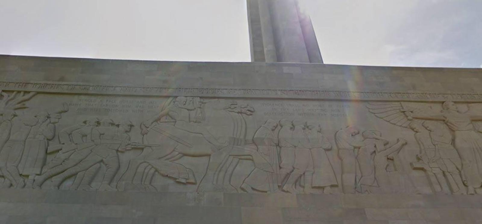 Modern photograph of the Great Frieze on the North Wall of the Liberty Memorial. Carved bas-relief figures populate the frieze: farmers, soldiers, riders on horses, and others.