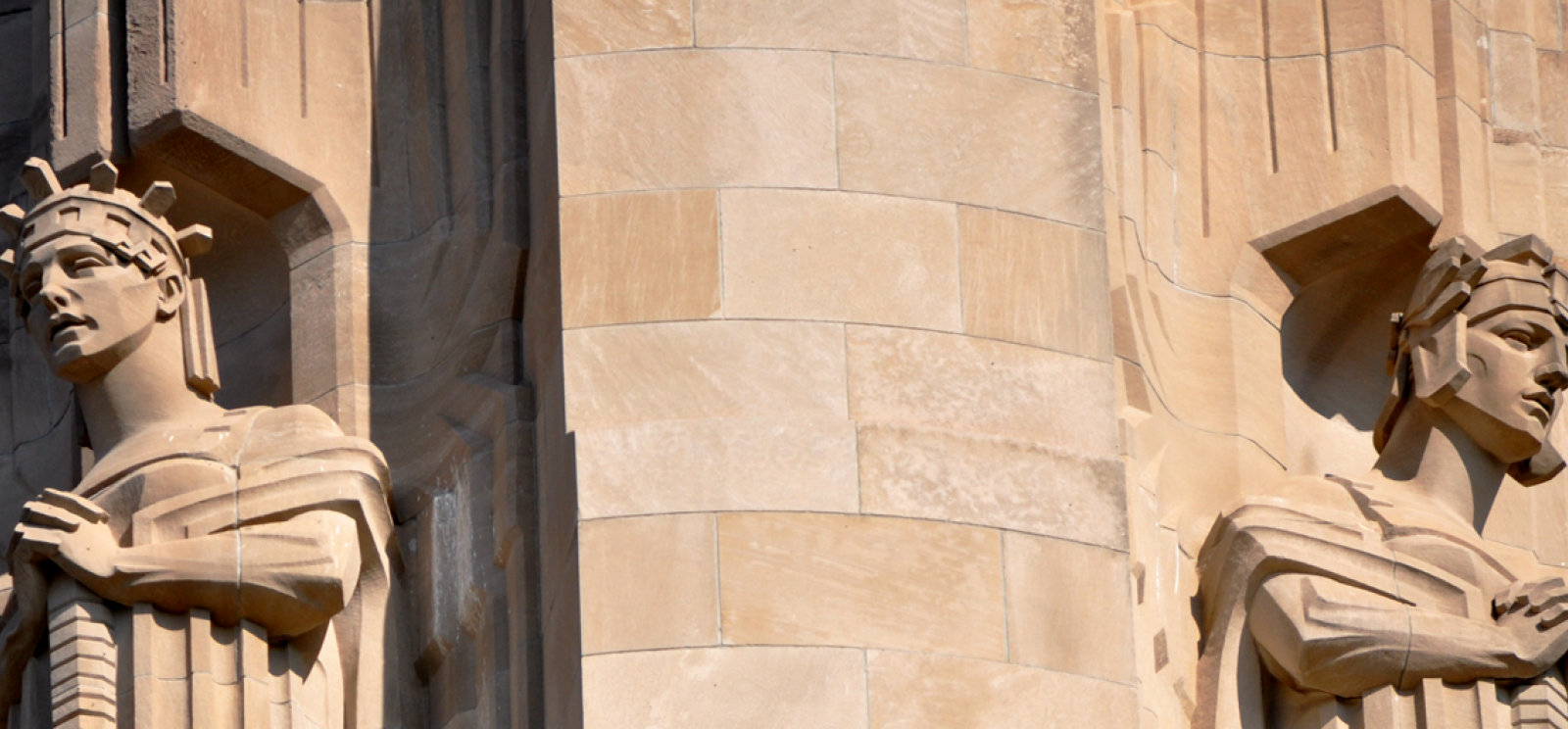 Modern photograph of the side of the Liberty Memorial tower. Two of the carved stone Guardians are visible.