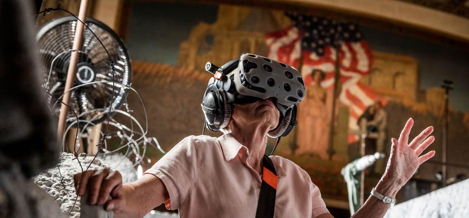 Woman wearing a VR headset in War Remains