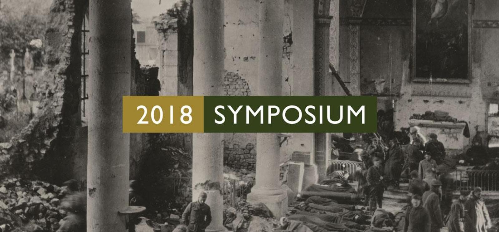 Background image: black and white hero of rows of soldiers/patients on pallets in a grand ruined building. Text: 2018 Symposium