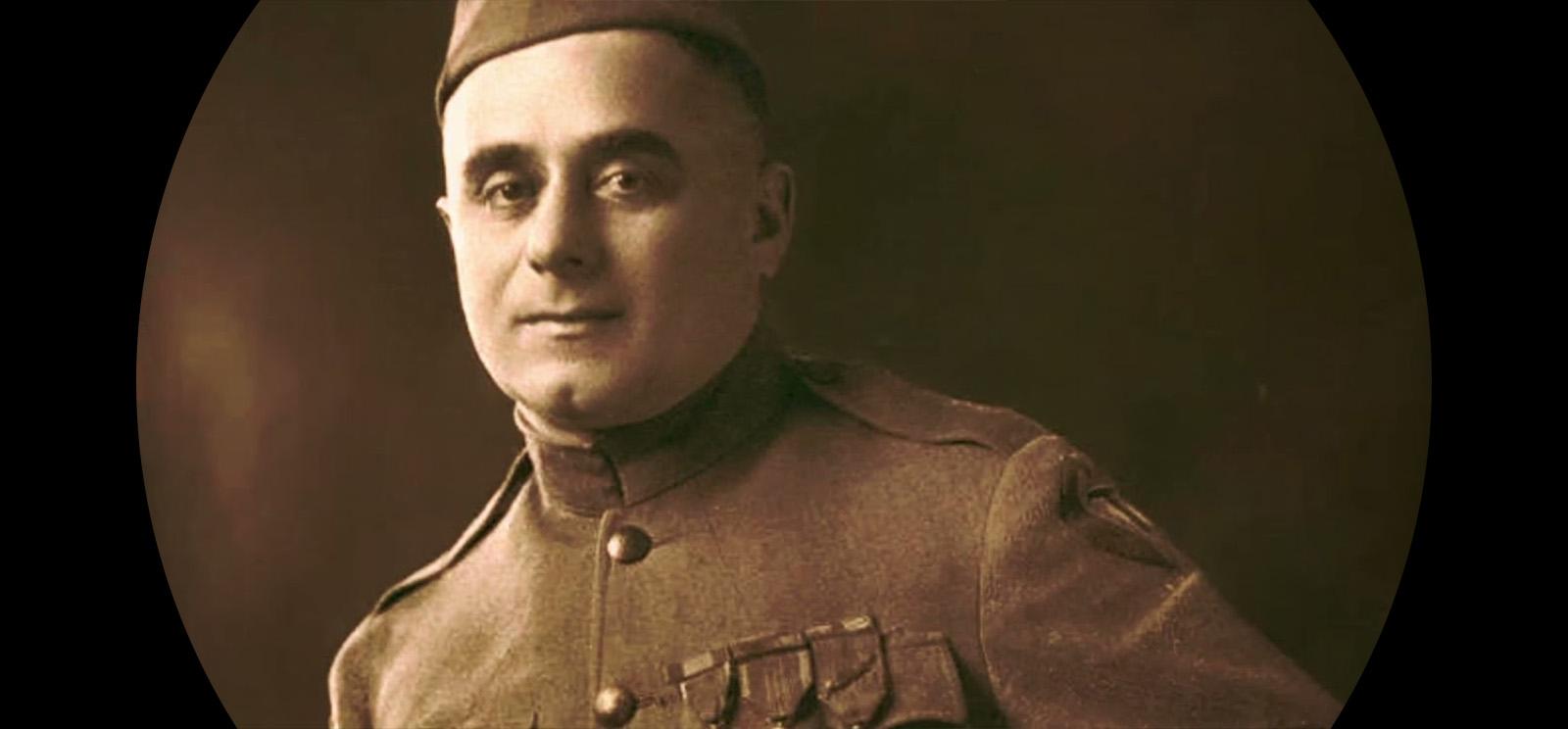 Sepia portrait photograph of a man in military dress uniform, bounded by a black circle.