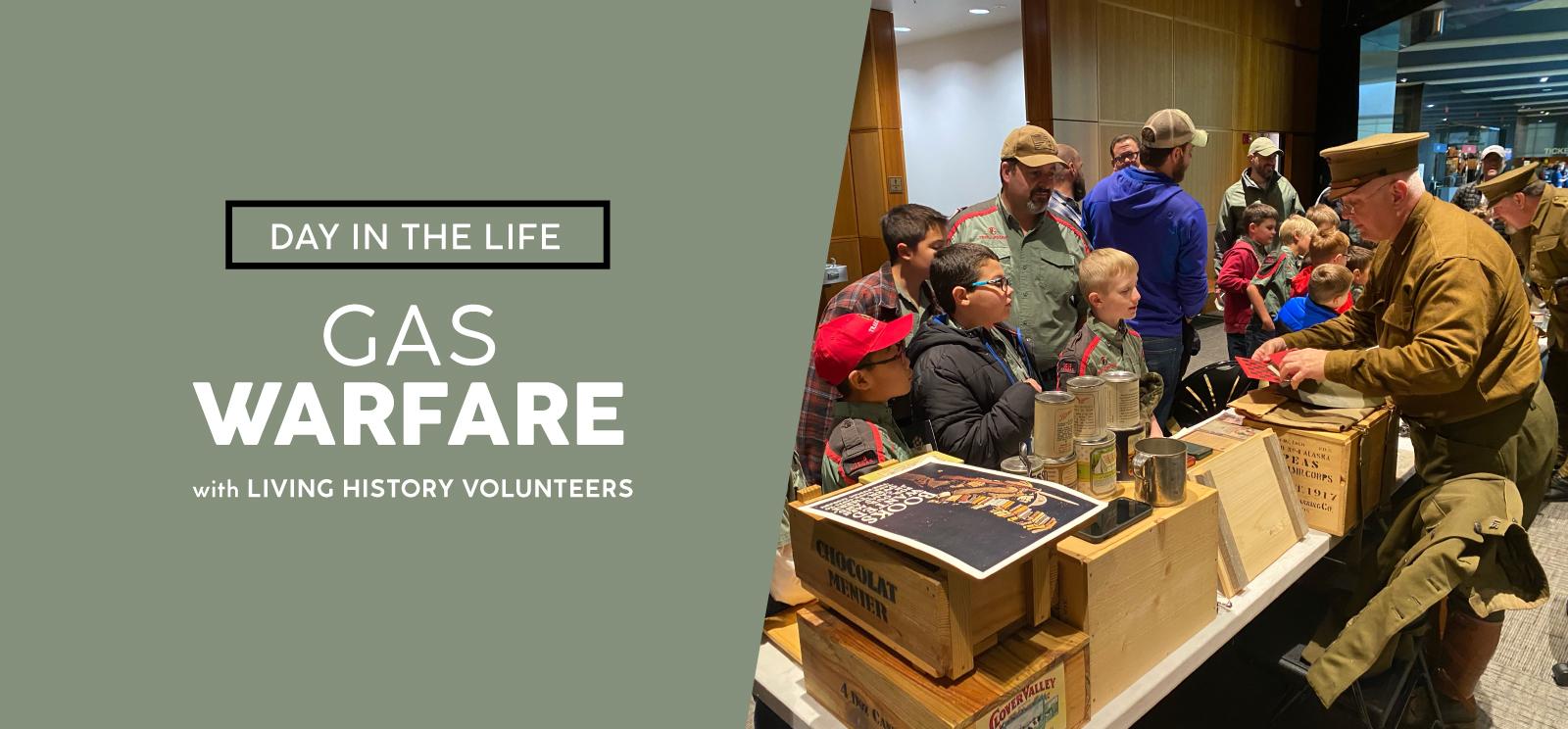 Image: Modern photograph of children gathered in front of a long table filled with WWI-era artifacts and reproductions. A man dressed in WWI-era uniform demonstrates with one of the artifacts in his hands. Text: Day in the Life / Gas Warfare