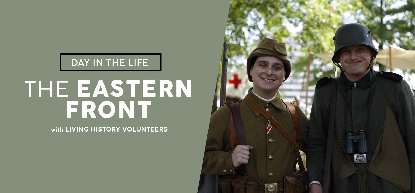 Modern photograph of two young white men smiling at the camera dressed in WWI uniforms. Text: Day in the Life / The Eastern Front