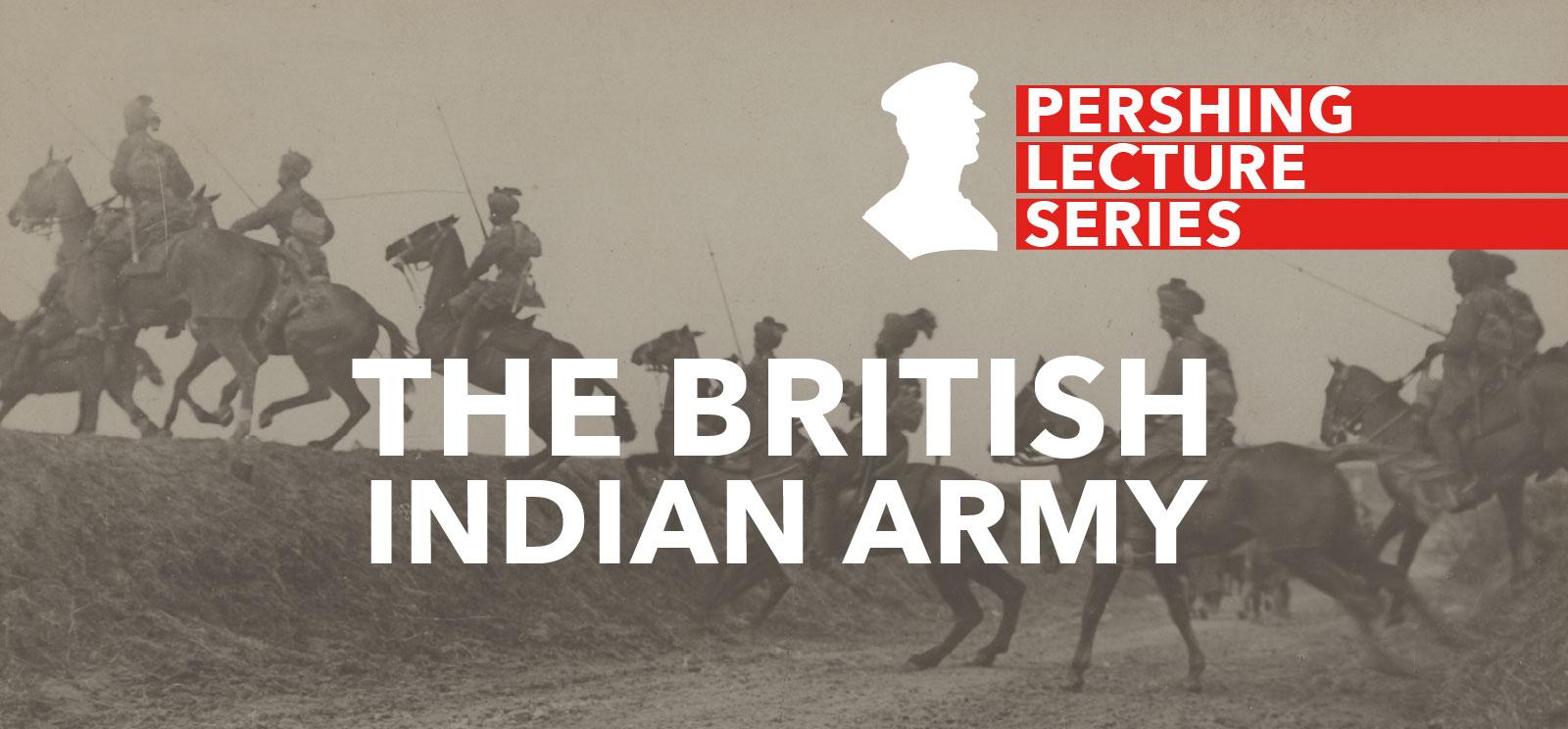 Black and white photo of WWI soldiers wearing turbans, riding horses and galloping across a road