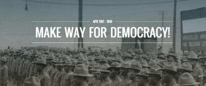 Image: Black and white photograph of rows of Black soldiers wearing military uniforms. Text: April 1917-1919. Make Way for Democracy!