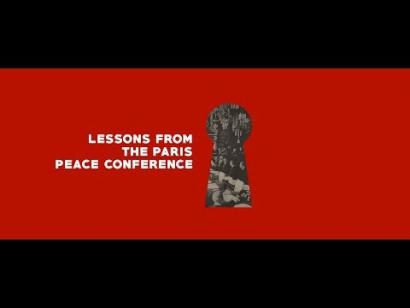 Presentation slide text: Lessons from the Paris Peace Conference. Image: A red background with a graphic of a keyhole through which we see a black and white photograph of diplomats at a table.