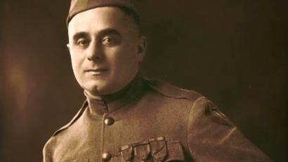 Sepia portrait photograph of a man in military dress uniform.
