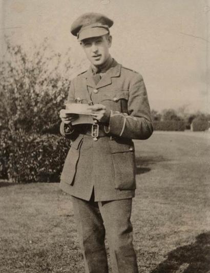  Portrait photo of Lt. Raymond B. Penniman, Royal Canadian Regiment, holding a letter