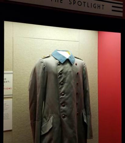 WWI overcoat, on mannequin in display case